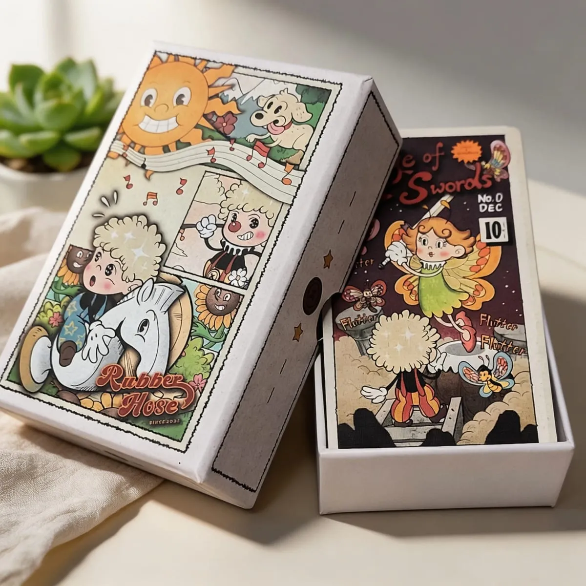 Dupla dombornyomott, 12*7 cm-es vintage gumitömlős Tarot pakli merev dobozban 78 régi rajzfilmes művészeti tarotkártya